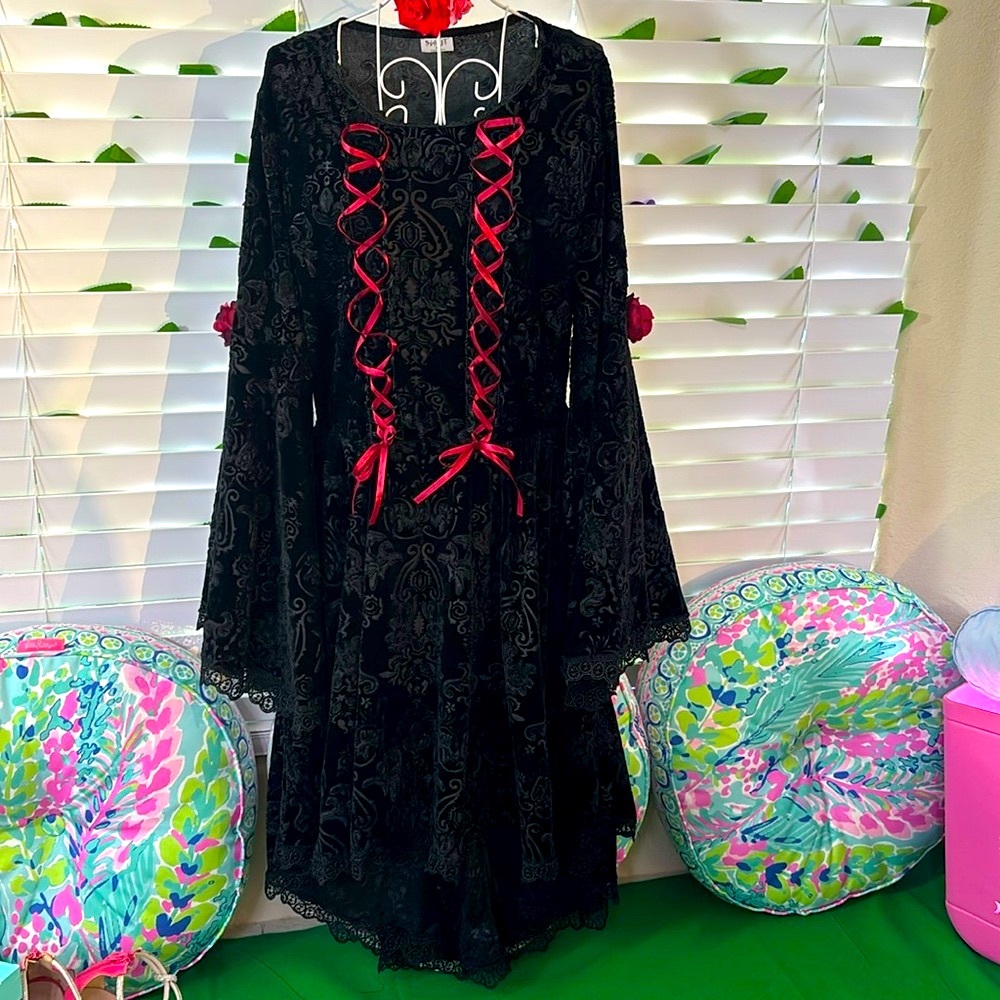 Black velvet costume with high-low hem